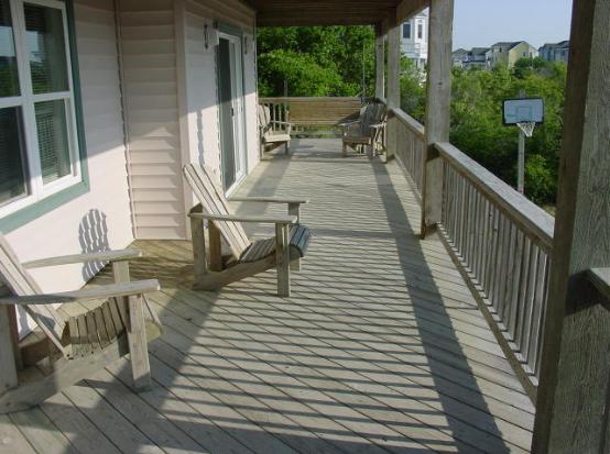 Need some Shade ? Smileaway has two large decks - this one is on the 2nd floor and offers views of the ocean and plenty of shade...plenty of furniture to relax...Don't miss our swing!