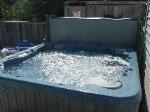 Enjoy our new Jumbo hot tub for 2006 - includes a deluxe waterfall and mood lighting