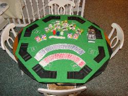 Poker Table Top (Folds up and is stored in 3rd floor BR Closet).  Poker Chips, Cards, Card Shuffler,