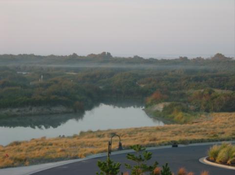 An early fall morning is the backdrop as fog shrouds the coastal area.  Not many large trees on the OuterBanks