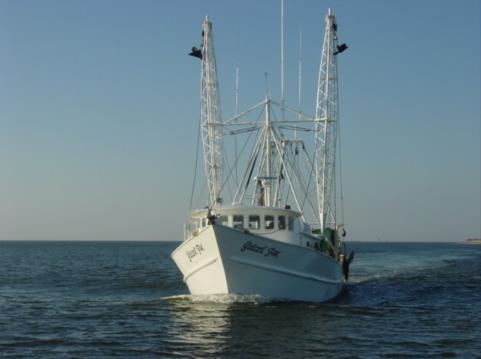 A fising boat heads in with its fresh catch of the day....many local restauraunts feature fish caught locally.  The Mackerel is great !