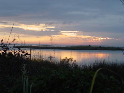 Enjoy world-class sunsets on the soundside in Corolla. Here calm winds permit a mirror perfect sunset
