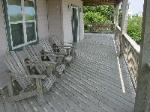 Mid-level deck.  Plenty of shade and furniture.  Don't miss our swing!