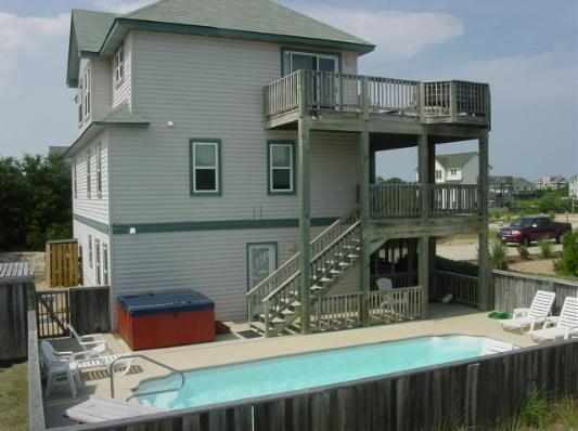 Here is a side view of Smileaway....large decking, pool and spa